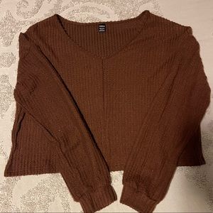 Brown waffle knit, long sleeve crop. Never worn. It’s very soft good material.